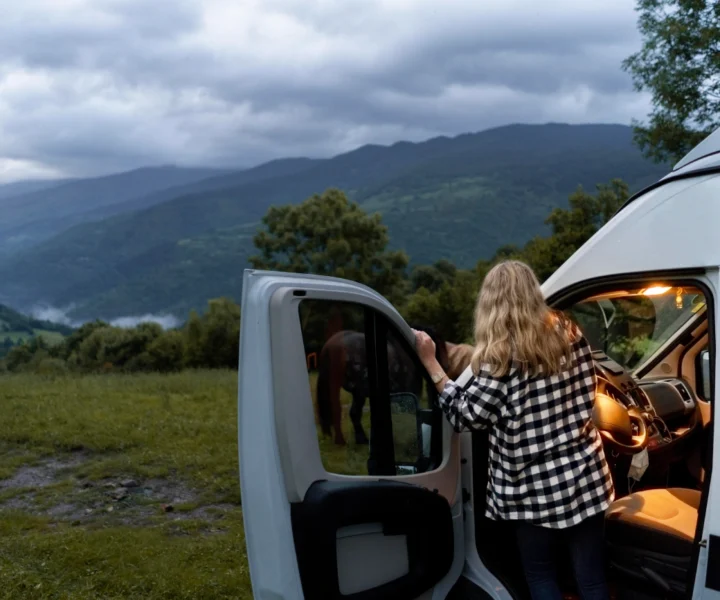 woman-relaxing-her-camper-daylight